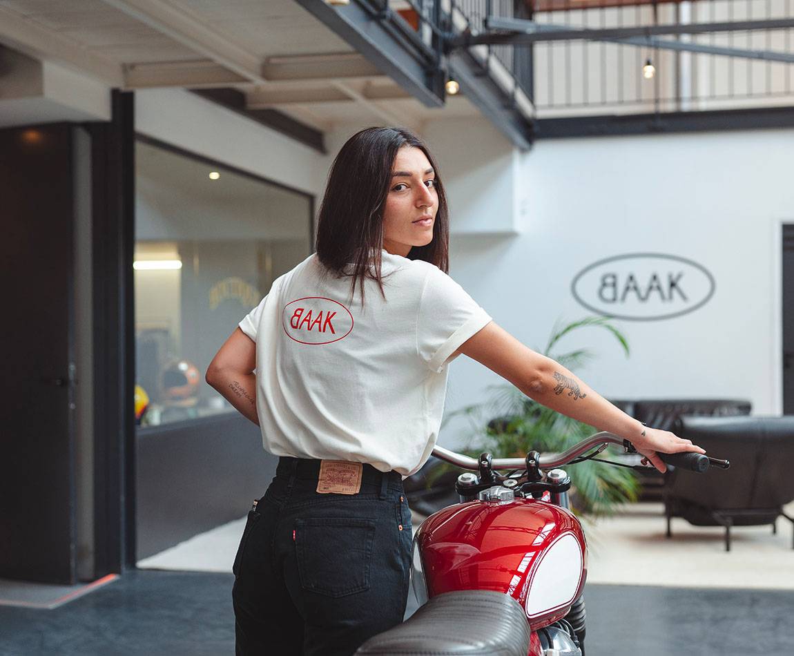 Cream T-Shirt - Short sleeves - Heart pocket on front - Screen-printed red BAAK logo on back Cream T-Shirt - Short sleeves - Heart pocket on front - Screen-printed red BAAK logo on back