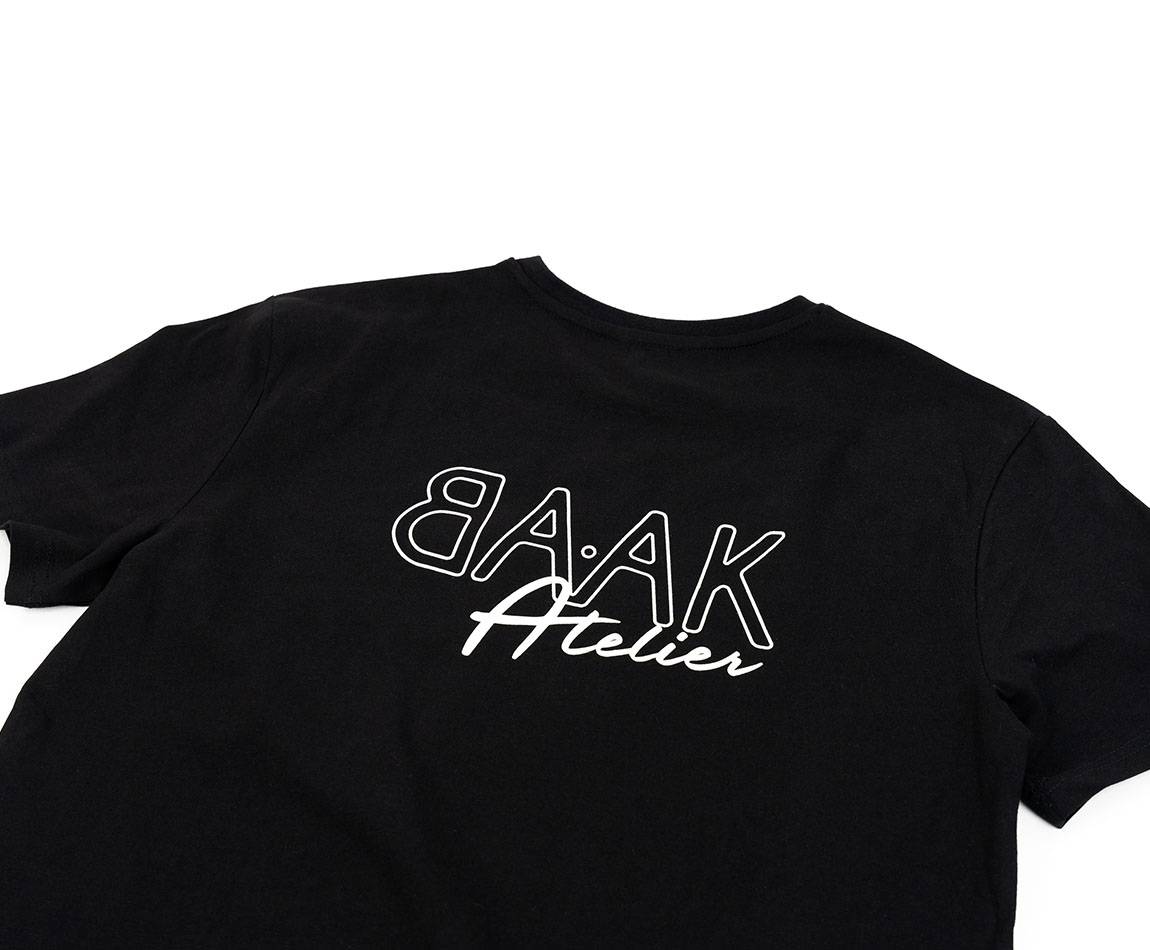 Black T-Shirt - Short sleeves - Heart pocket on front - White "BAAK Atelier" silk-screen print on back Black T-Shirt - Short sleeves - Heart pocket on front - White "BAAK Atelier" silk-screen print on back
