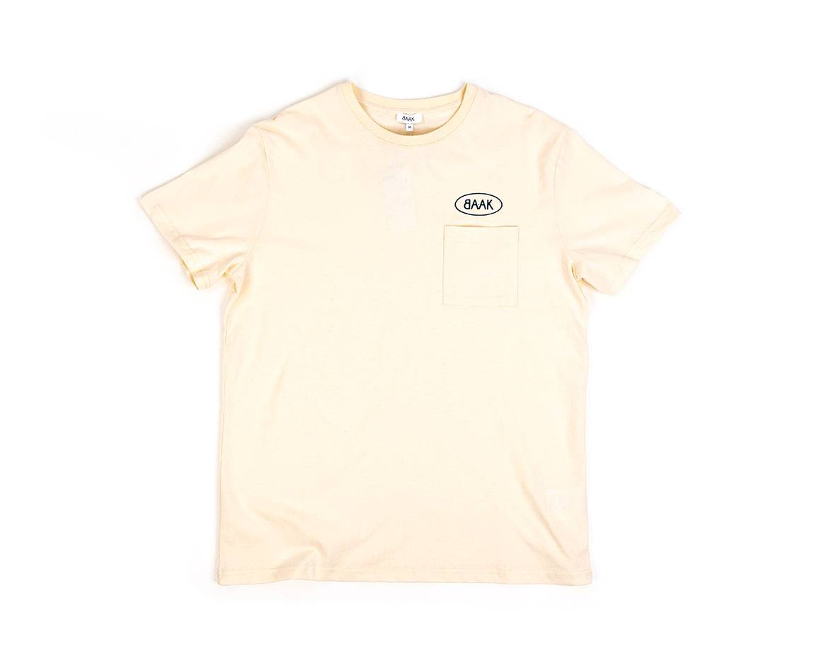 Cream T-Shirt - Short sleeves - Heart pocket on front - Petrol blue BAAK logo silk-screened above pocket Cream T-Shirt - Short sleeves - Heart pocket on front - Petrol blue BAAK logo silk-screened above pocket