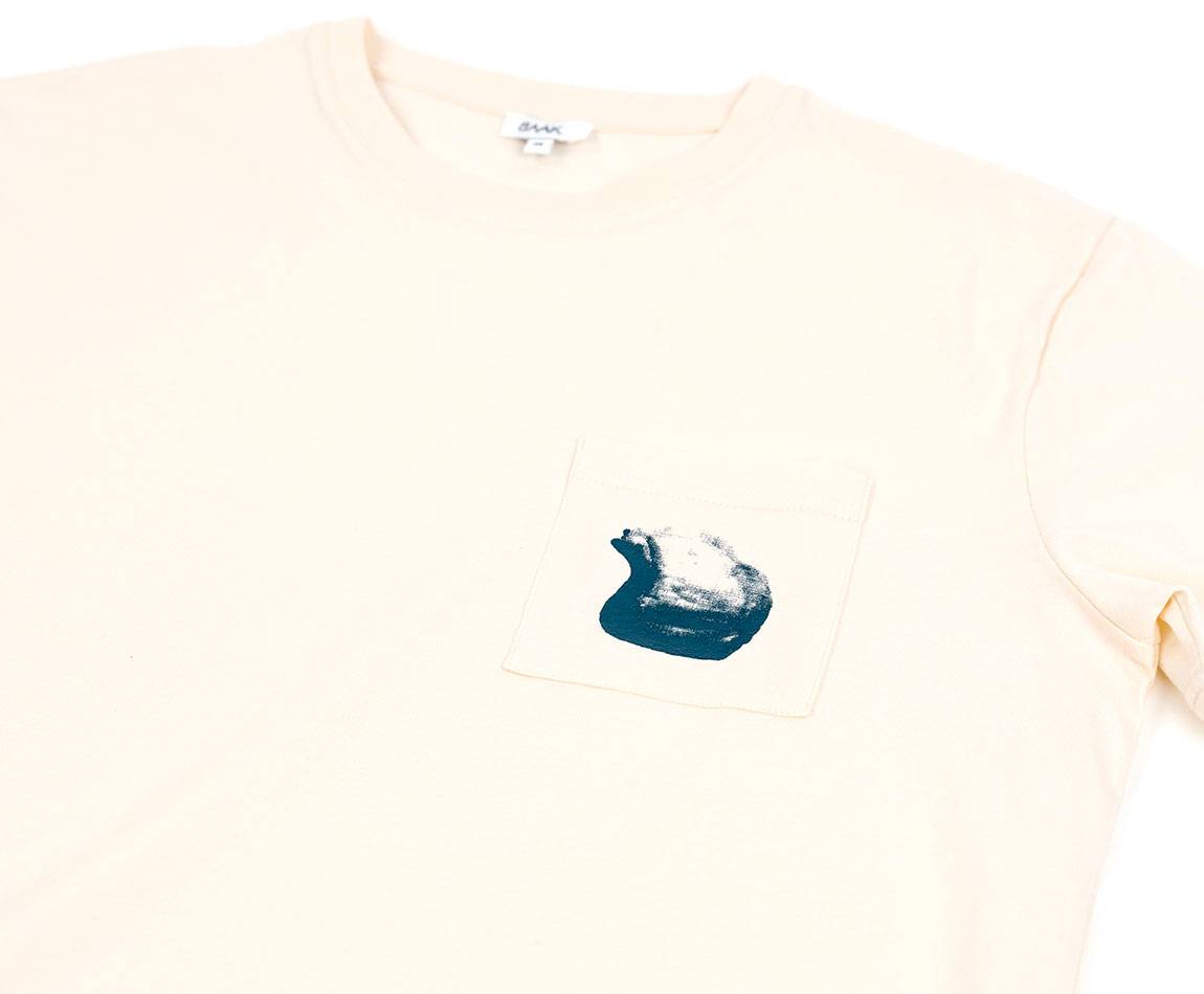 Cream T-Shirt - Short sleeves - Heart pocket on front - Silk-screened petrol blue helmet motif on pocket Cream T-Shirt - Short sleeves - Heart pocket on front - Silk-screened petrol blue helmet motif on pocket